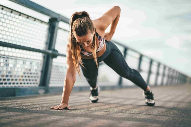 Exercise benefits beyond aesthetics, woman working out outdoors.