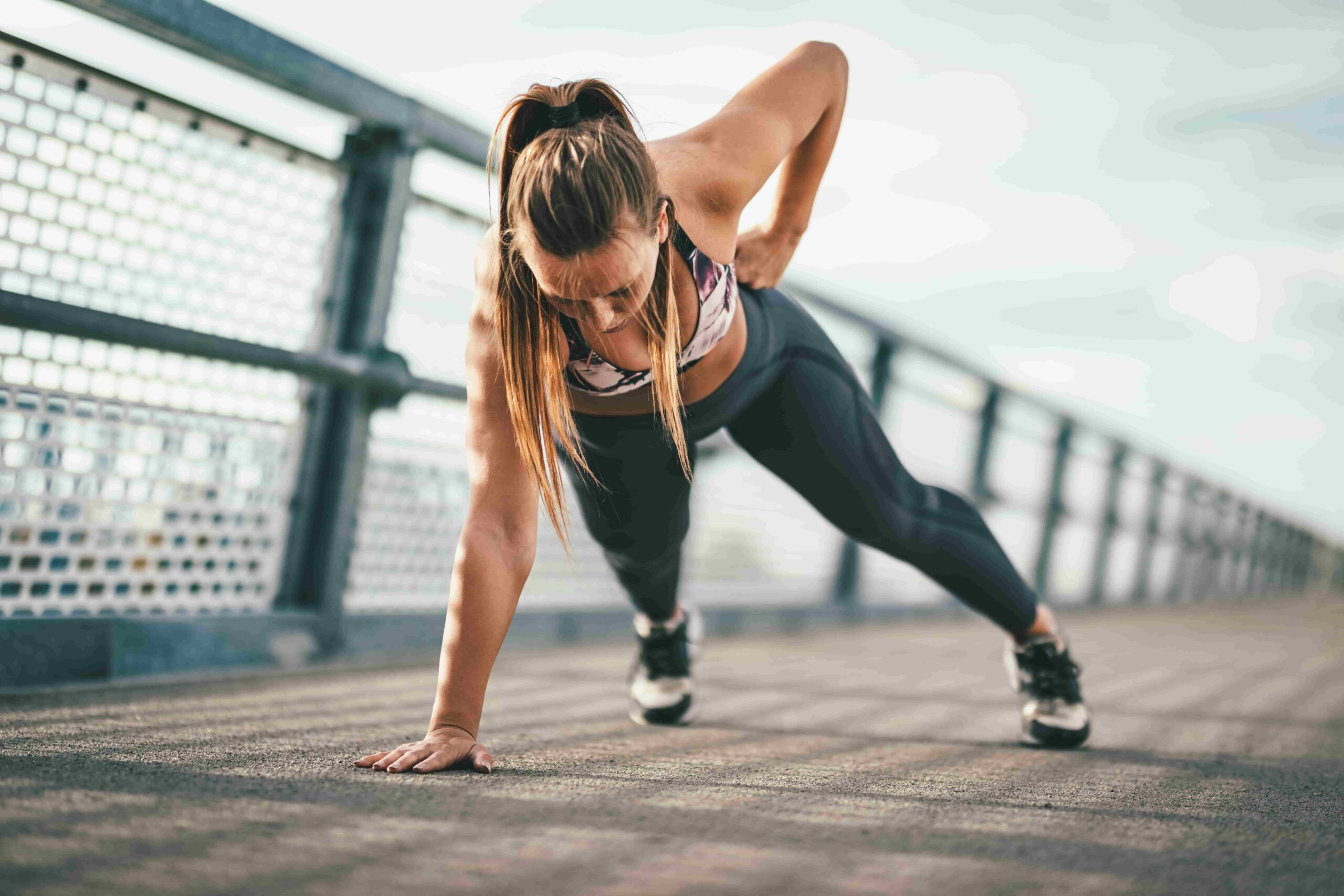 Exercise benefits beyond aesthetics, woman working out outdoors.